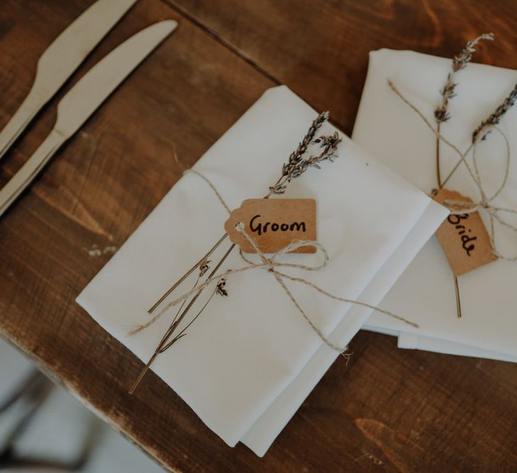 Hand tied place settings with name tags and lavender