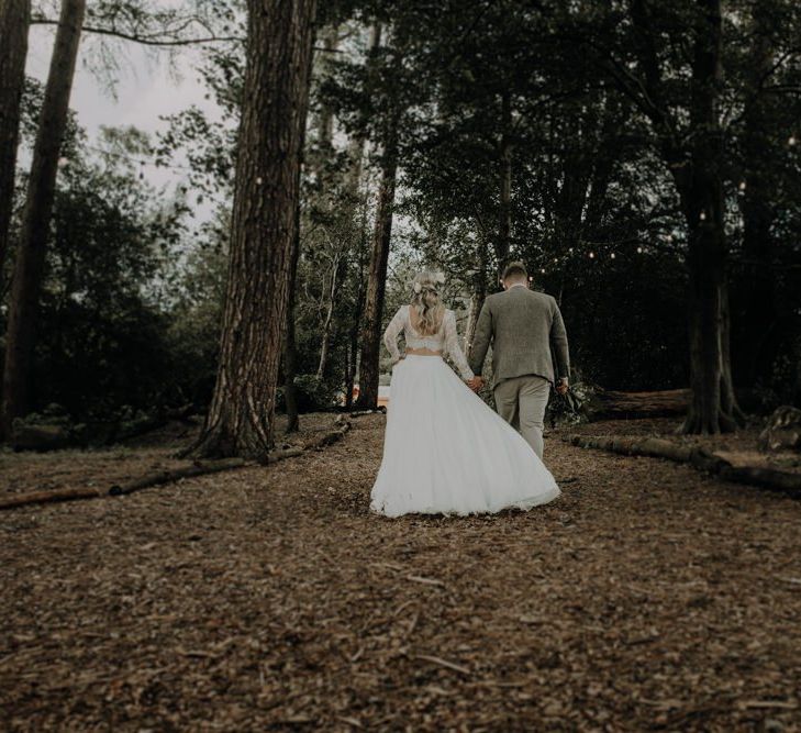 Bride and groom steal a moment at Hobbit Hill for outdoor country wedding with festival touches