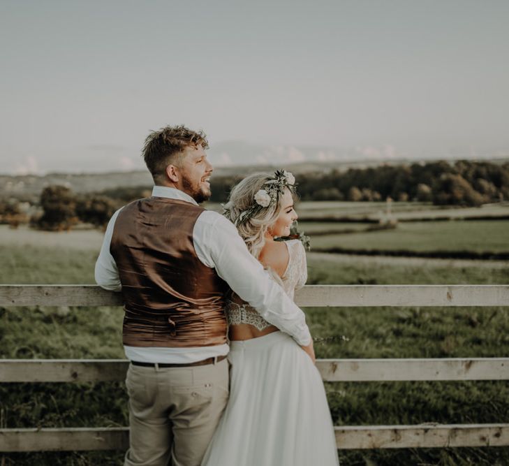 Bride and groom enjoy their outdoor wedding at Hobbit Hill with relaxed festival styling