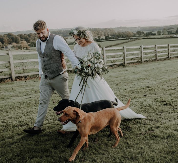 Bride and grooms dogs arrive to steal the show at their outdoor wedding