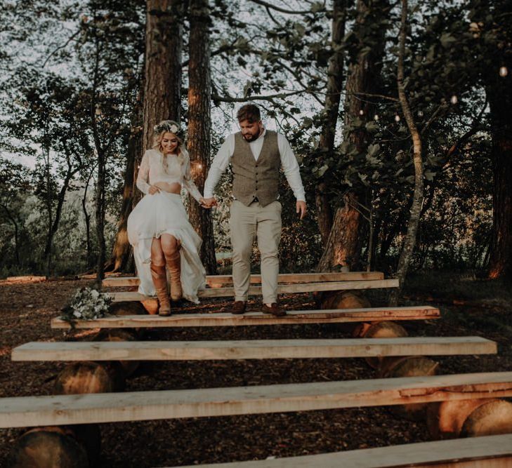 Bride wearing two piece bridal dress and white floral head piece for relaxed country wedding