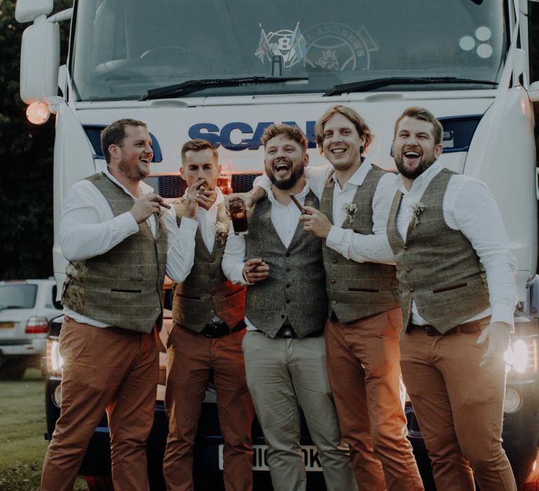 Groom and his groomsmen celebrate at Hobbit Hill for outdoor country wedding