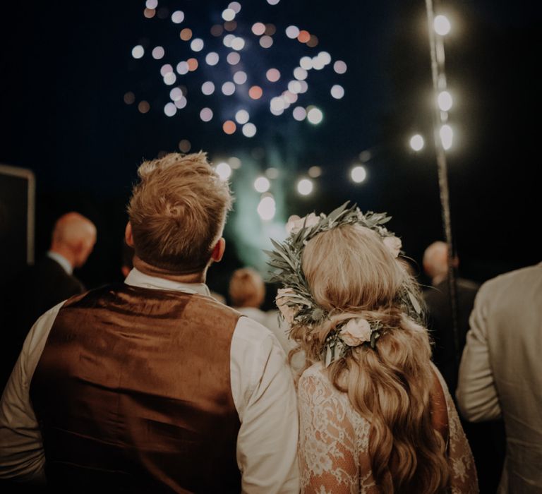 Bride and groom enjoy the fireworks at Hobbit Hill for outdoor country wedding