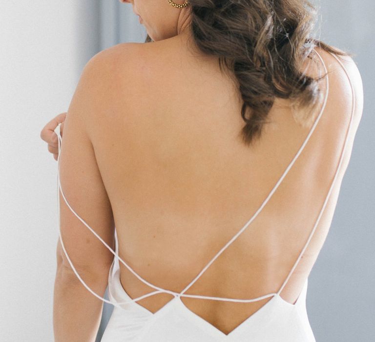 Open Strappy Minimalist Wedding Dress With Hair Down