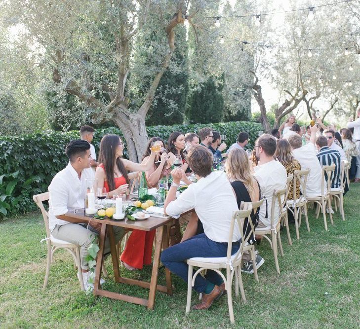 Guests Cheers Wedding Speeches and Enjoy Outside Wedding In Italy