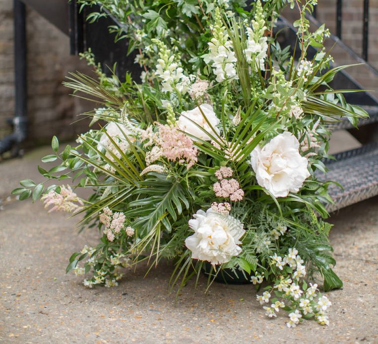 Green, White and Pink Wedding Flowers to Decorate Bottom of Stairs