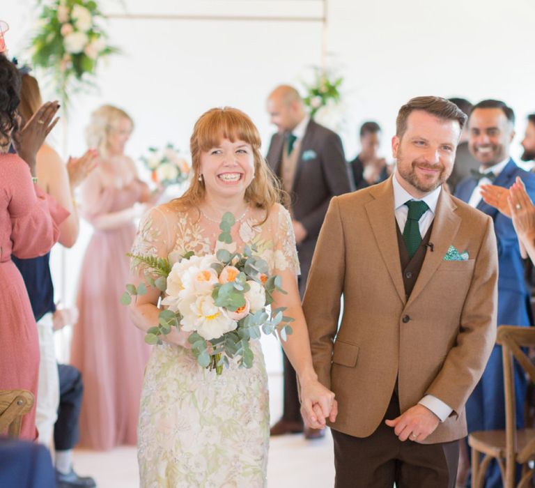 Bride in Jenny Packham Cassiopeia Wedding Dress with Groom in Brown Trousers and Blazer Just Married