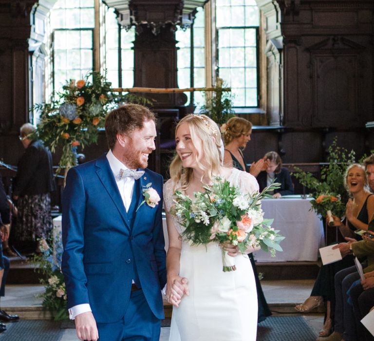 Bride in Sassi Holford Tamara Wedding Dress and Groom in Navy Blue Ted Baker Suit Happily Married