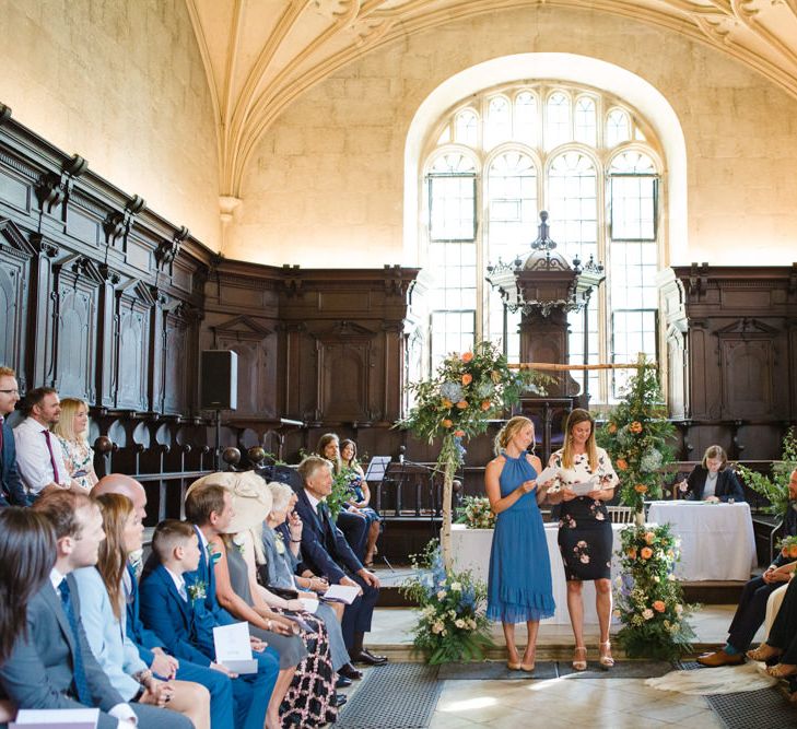 Friends Performing Readings During The Wedding Ceremony