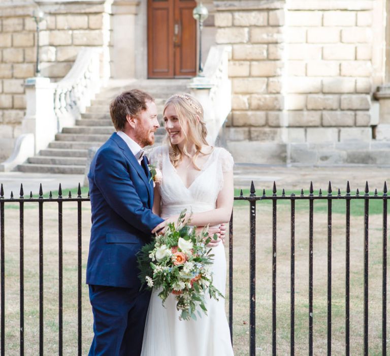 Bride in Sassi Holford Tamara Wedding Dress and Groom in Navy Ted Baker Suit Hugging