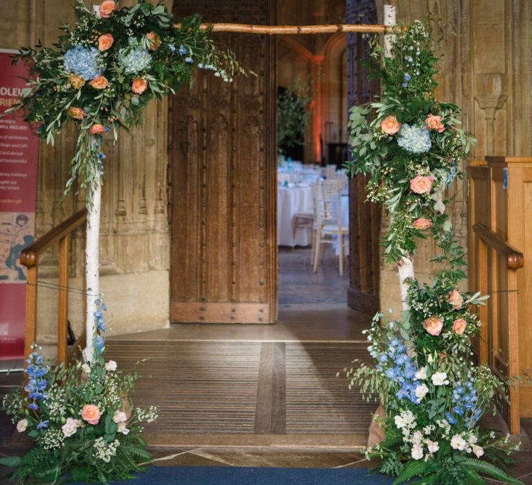 Branch Frame Altar with Coral and Blue Floral Wedding Flowers