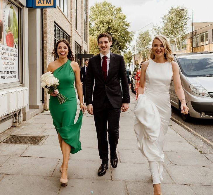 Bride wearing beautiful dress before changing into her bridal jumpsuit