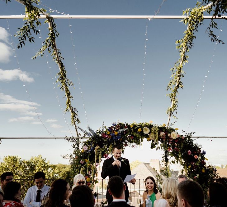 Outdoor rooftop wedding in London with bridal jumpsuit