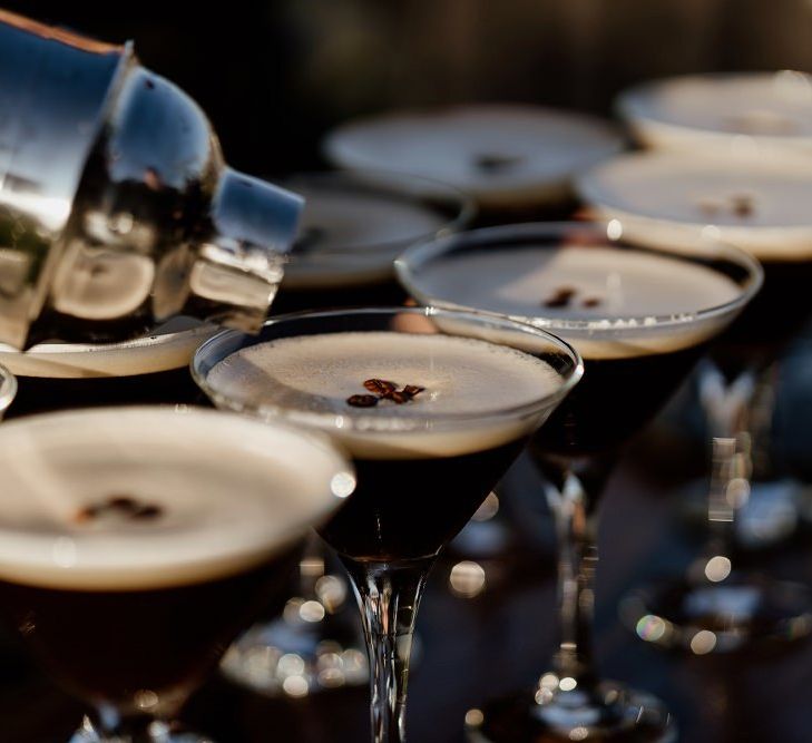 Espresso martinis at private rooftop wedding with bridal jumpsuit