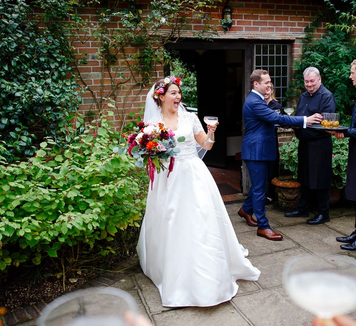 Autumnal Village Wedding with Deep Red &amp; Blue Colour Scheme at Ramster Hall, Surrey | Watters Bridal Gown | Warehouse Bridesmaid Dresses | Navy Suit Supply Suits | Tony Hart Photo