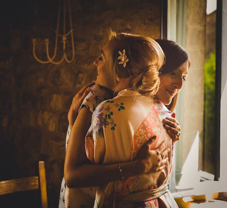 Intimate Prosecco Pool Party Wedding in Tuscany. Bride wears Livio Lacurre Gown, Groom wears Beggars Run Custom Suit. Photography by Livio Lacurre.