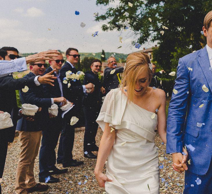 Intimate Prosecco Pool Party Wedding in Tuscany. Bride wears Livio Lacurre Gown, Groom wears Beggars Run Custom Suit. Photography by Livio Lacurre.