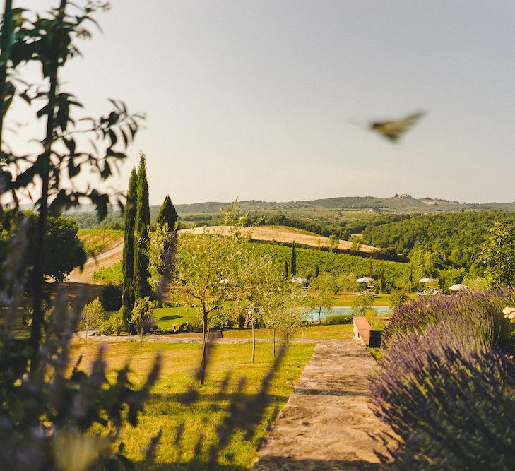 La Pieve Marsina. Intimate Prosecco Pool Party Wedding in Tuscany. Bride wears Livio Lacurre Gown, Groom wears Beggars Run Custom Suit. Photography by Livio Lacurre.