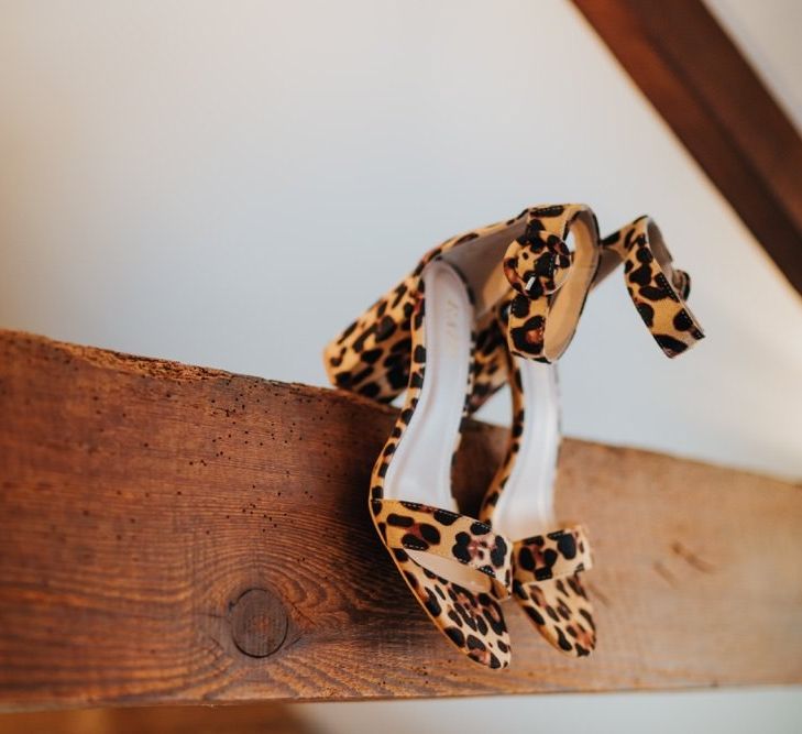 Brides leopard print heels at outdoor spring wedding