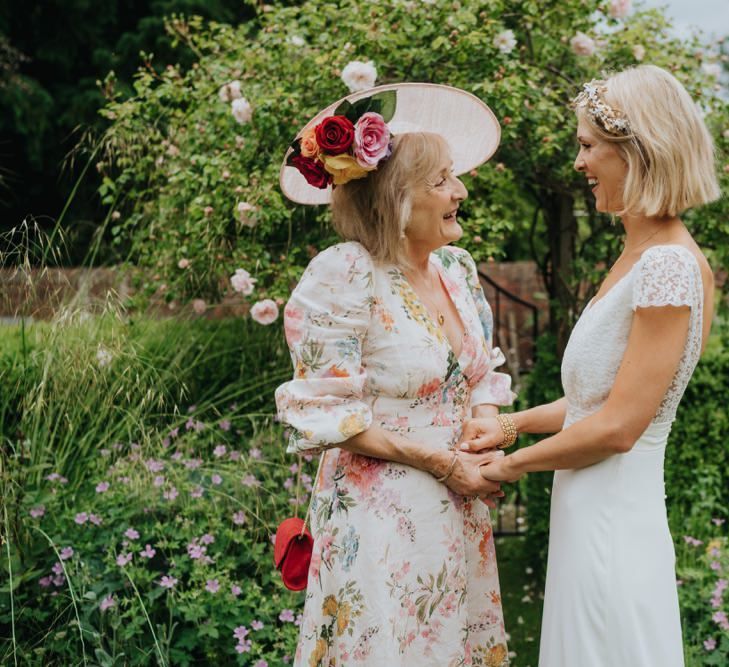 Bride wearing a beautiful laced top bridal dress and gold embellished headband at Newburgh Priory