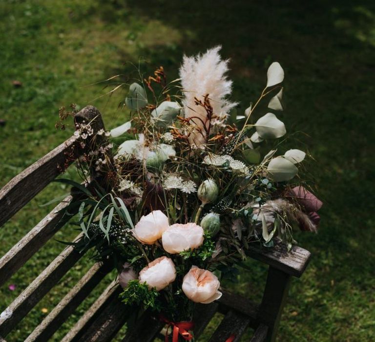 Beautiful floral and pampas grass bouquet tied with ribbon