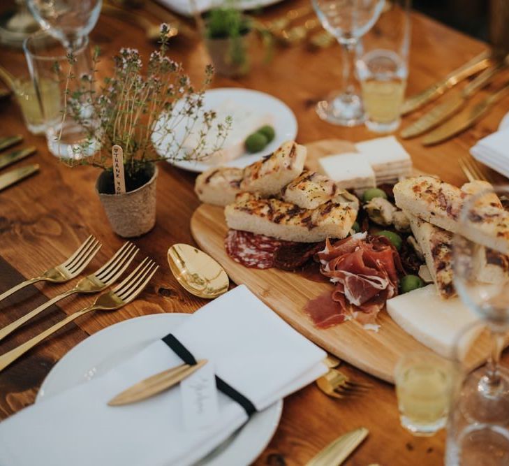 Table setting details with mini herb plant wedding favours