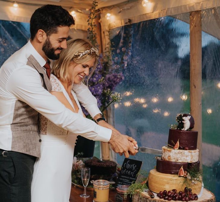 Bride and groom cut the cheese cake