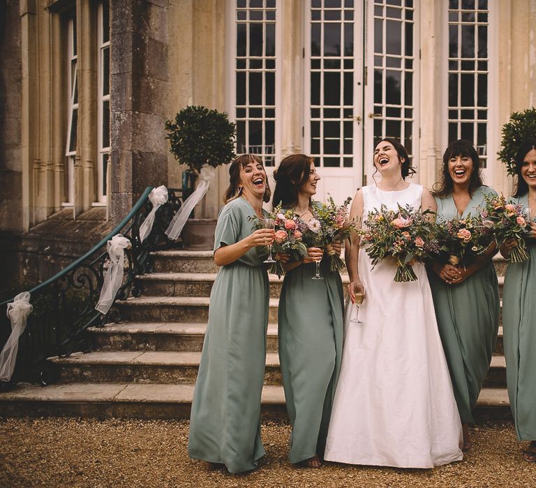 Bride in Homemade Wedding Dress and Bridesmaids in  Green Wrap Dresses from &amp; Other Stories