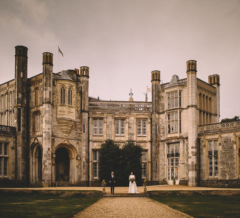 Bride and Groom in Front of Highcliffe Castle in Dorset