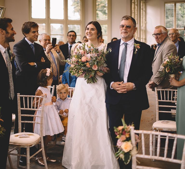 Wedding Ceremony Bridal Entrance with Bride in Homemade Wedding Dress and Protea Wedding Bouquet