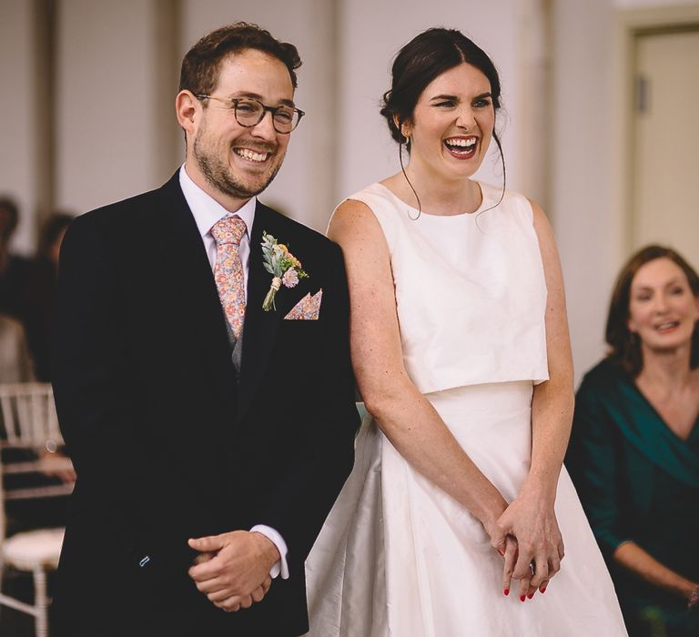 Bride and Groom Laughing During The Wedding Ceremony