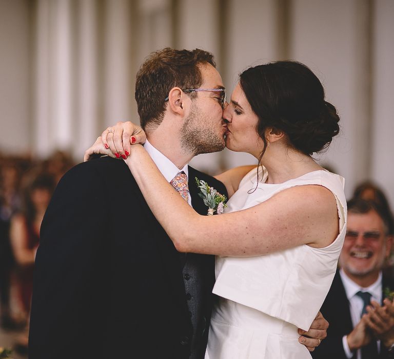 Bride and Groom Kissing During The Wedding Ceremony