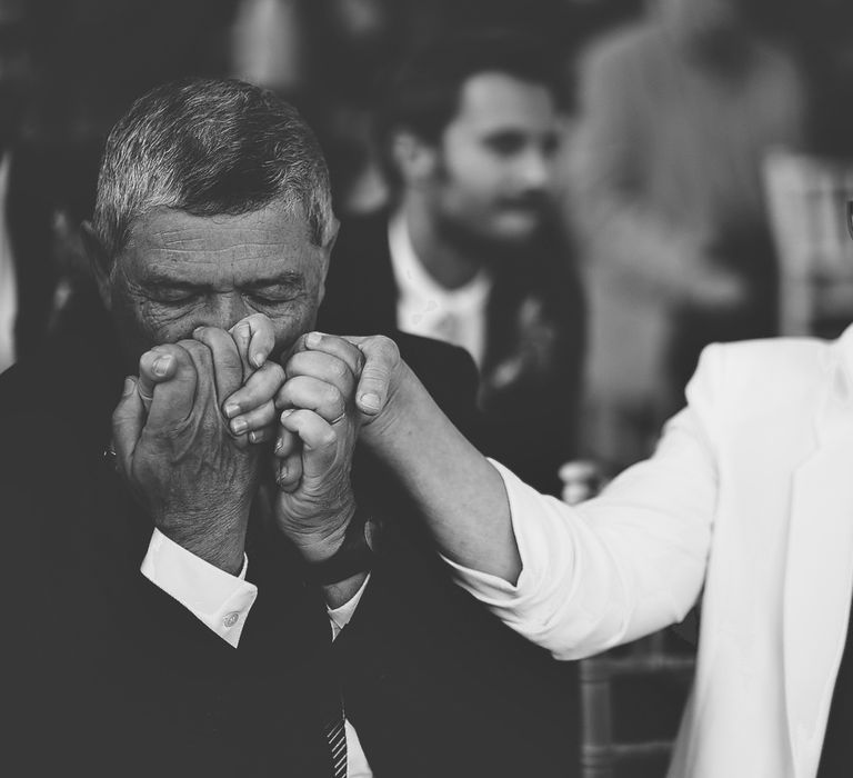 Wedding Guests Kissing his Wife's Hand