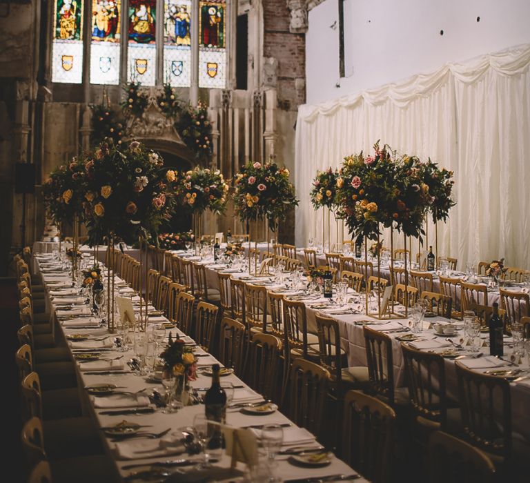 Wedding Reception at Highcliffe Castle with Stain Glass Windows and Tall Centrepieces