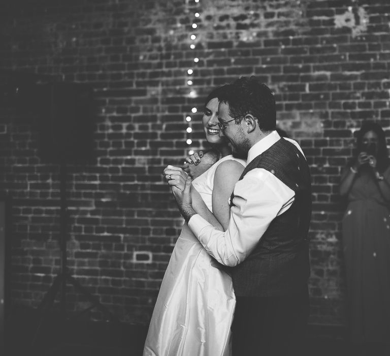 Bride and Groom Dancing with Fairylight Backdrop