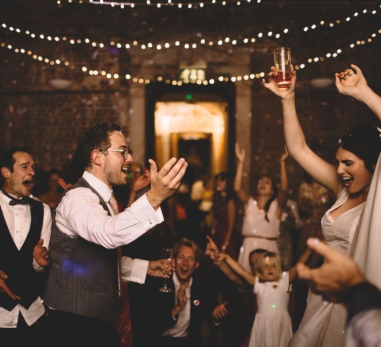 Bride and Groom Dancing at Evening Reception with Fairylight Backdrop