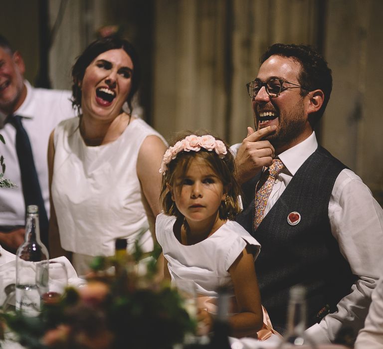 Bride and Groom Laughing During The Wedding Speeches