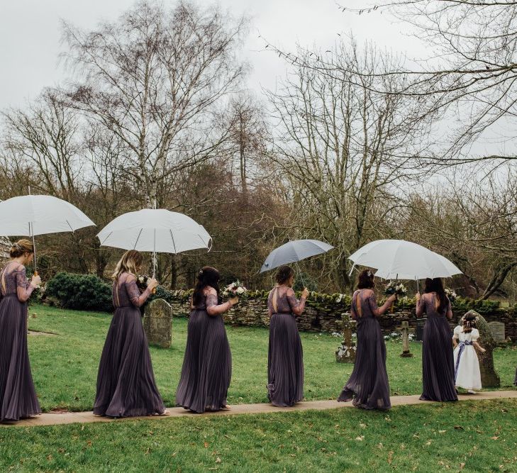 Bridemaids with umbrellas