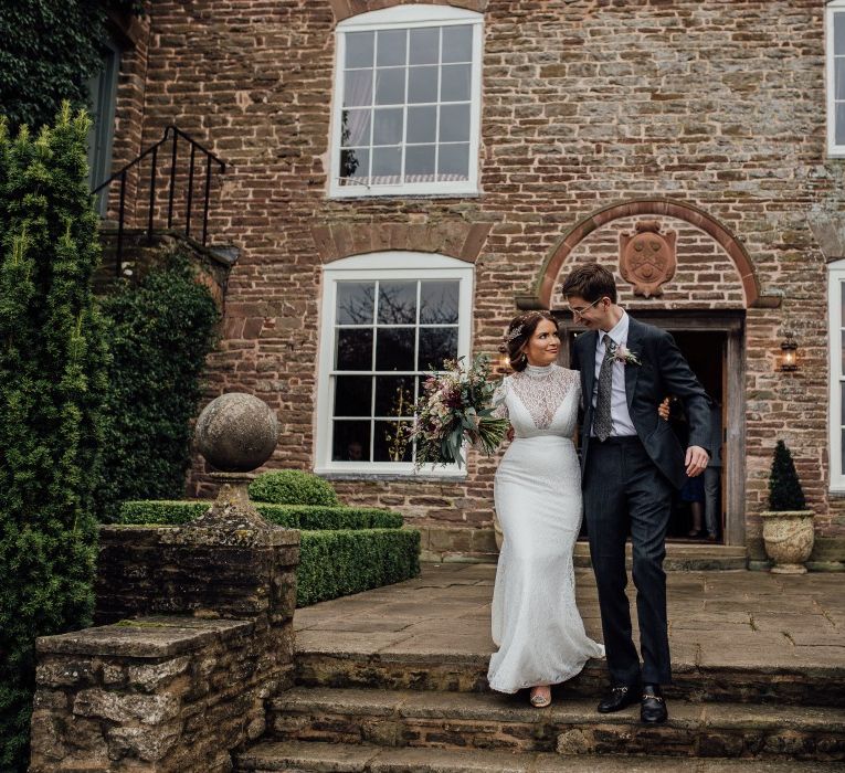 Bride and Groom outside Dewsall Court