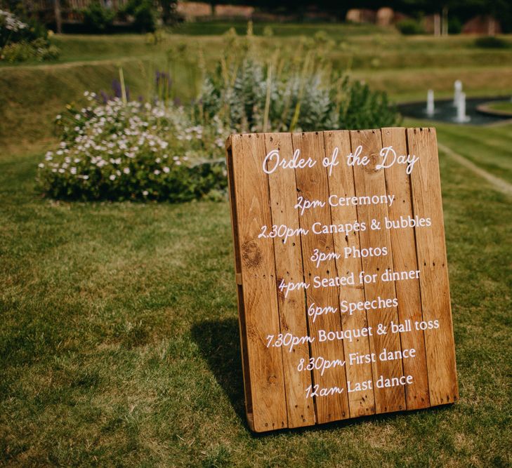 Wooden Order of the Day Wedding Sign | DIY Rustic Tipi Wedding at Riverhill Gardens, Sevenoaks | Frances Sales Photography