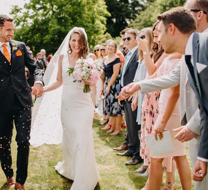 Confetti Moment | Bride in Halo &amp; Wren Wedding Dress | Groom in Moss Bros. Suit | DIY Rustic Tipi Wedding at Riverhill Gardens, Sevenoaks | Frances Sales Photography