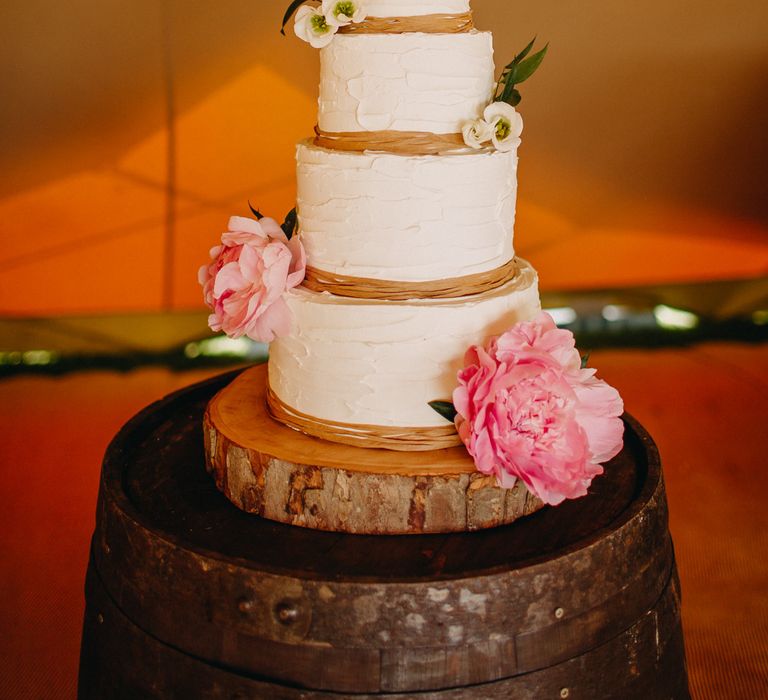 Cream Frosting Wedding Cake on Tree Slice Cake Stand | Wedding Decor | DIY Rustic Tipi Wedding at Riverhill Gardens, Sevenoaks | Frances Sales Photography