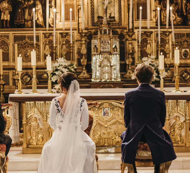 Church Wedding Ceremony with Bride in Nnavascues Embroidered Back Wedding Dress and Groom in Navy Suit