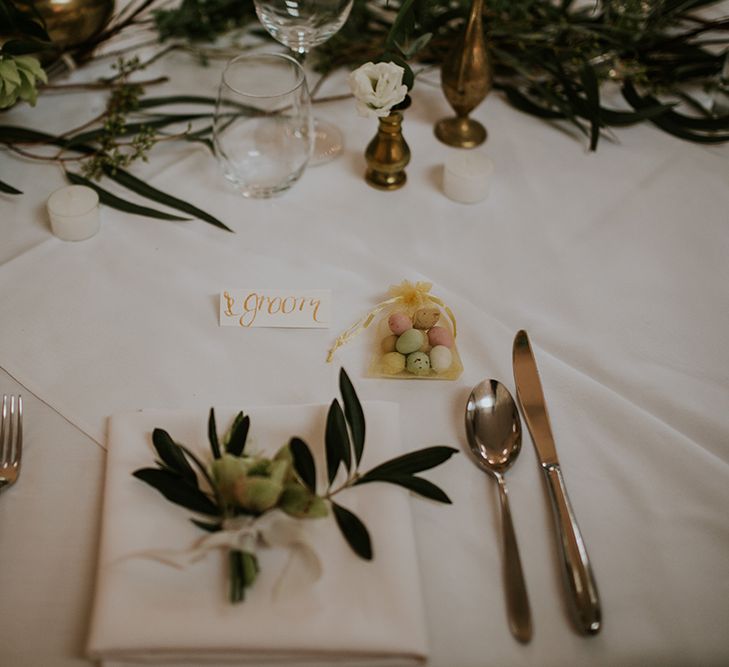 Elegant Place Setting with Sugared Almonds and Fresh Flower Stem