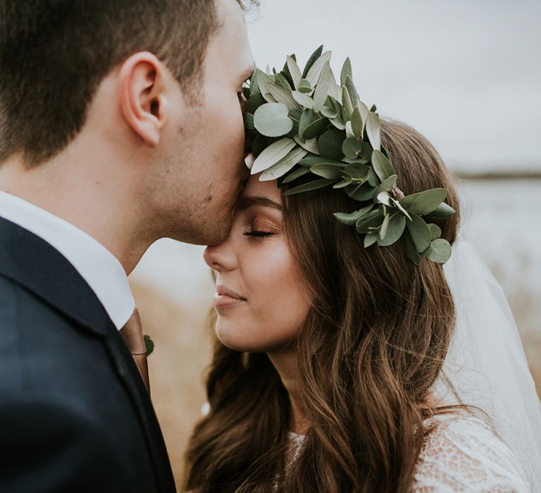 Groom Kissing His Brides Forehead