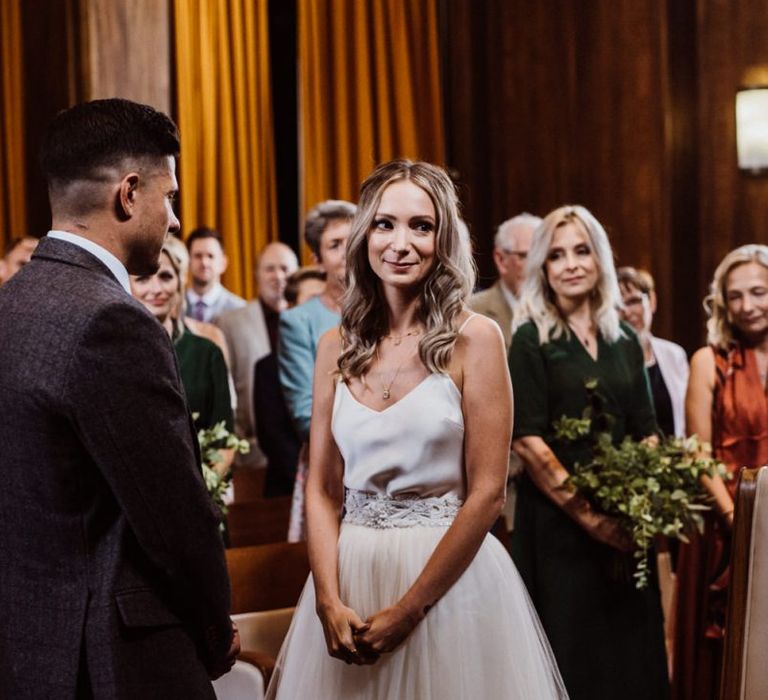 Bride wearing two piece Halfpenny London dress with  belt at Stoke Newington Town Hall