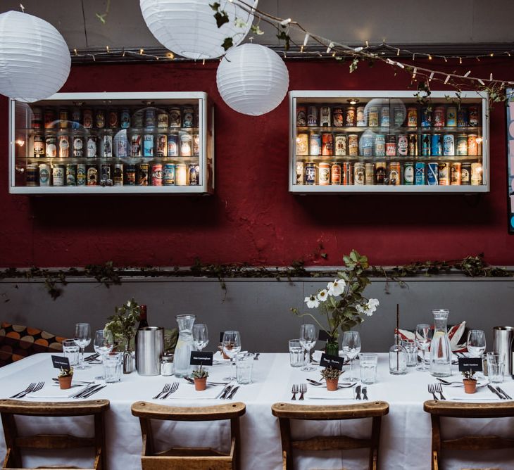 Pub reception with hanging foliage and paper lantern decor