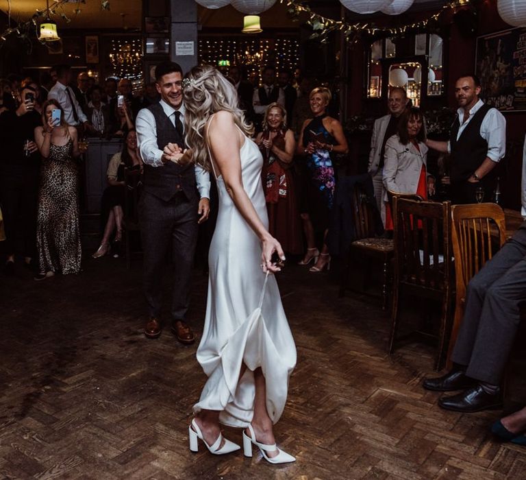 Bride and grooms first dance at pub reception