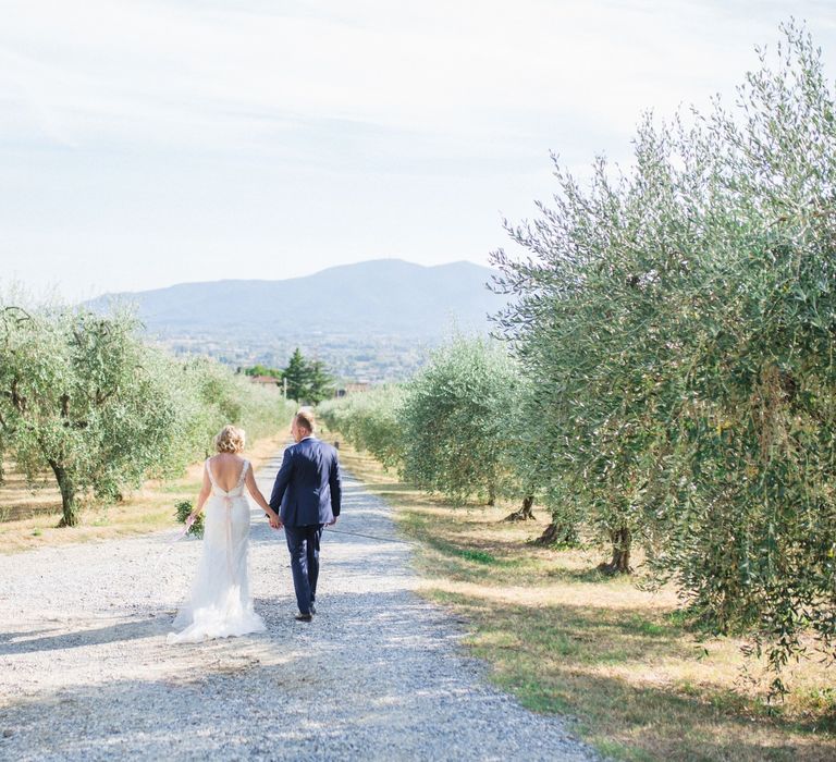 Bride in Lace Stella York Bridal Gown | Groom in Navy Suit | Four Day Italian Destination Wedding at Frattoria Mansi Bernadini Planned by Weddings by Emily Charlotte | Cecelina Photography