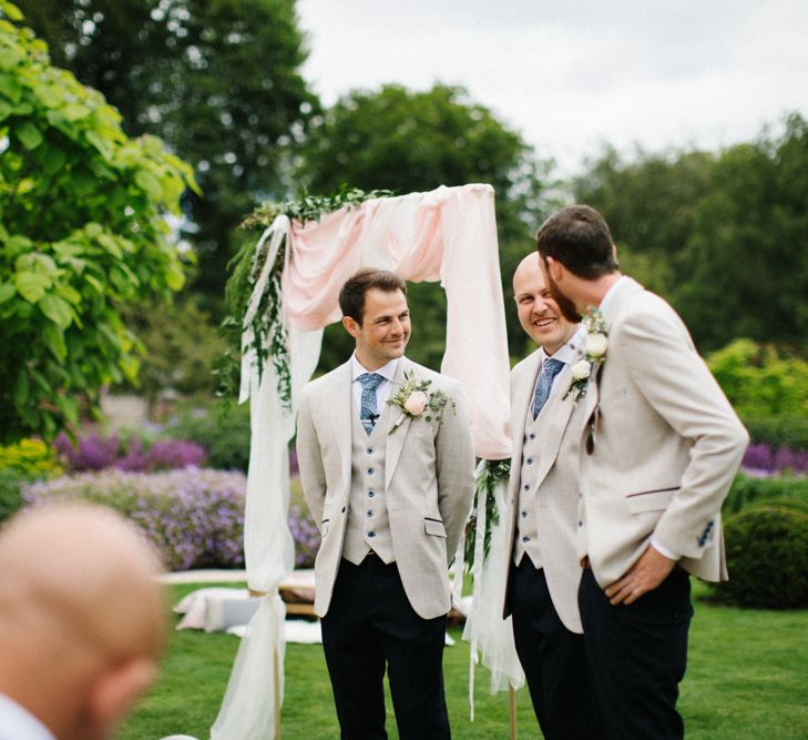 Groomsmen at the Altar in Beige Blazers and Black Chinos